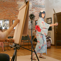 Photo from Eau Claire Artist's Drawing Night event with a model dressed in a yukata